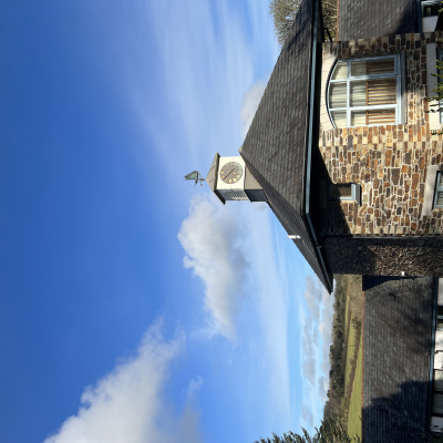 Clock tower by cottages