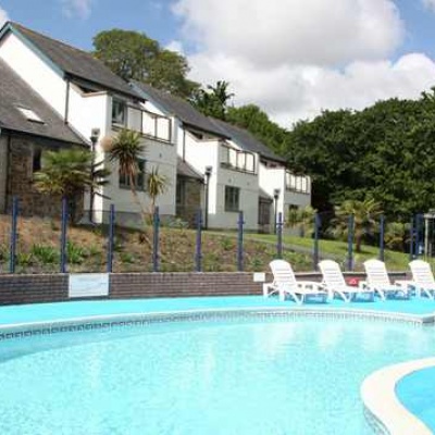 Holiday homes looking over an outdoor pool