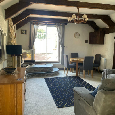 Large lounge with patio doors leading to the private patio area