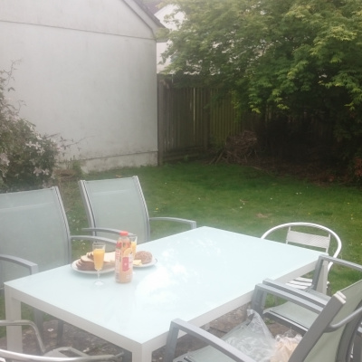 patio table in sunny enclosed garden