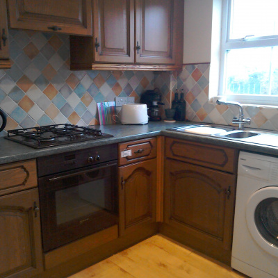 Kitchen with full size fridge, freezer,oven,hob,washing machine etc