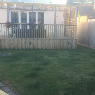 Rear decking and lawn.