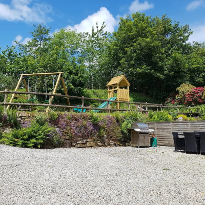 Outside seating/dining area with shared garden/play area