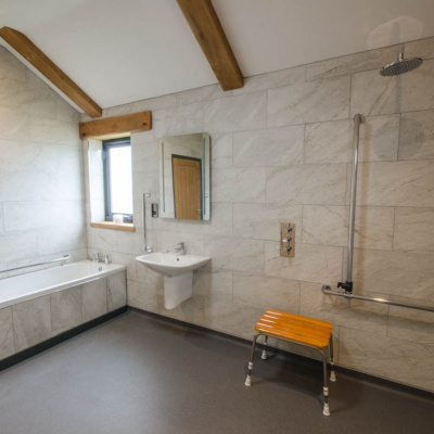Level access shower and seperate bath