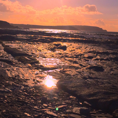 Sunset On Rocky Beach